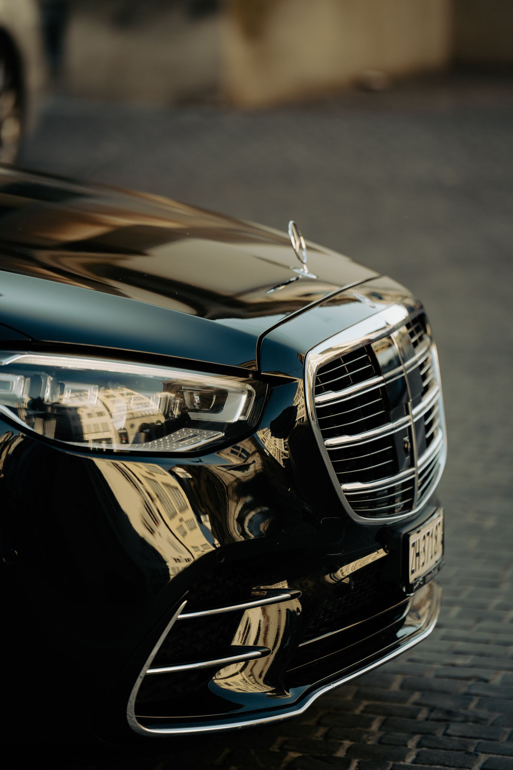 A gleaming black luxury car after a professional steam clean