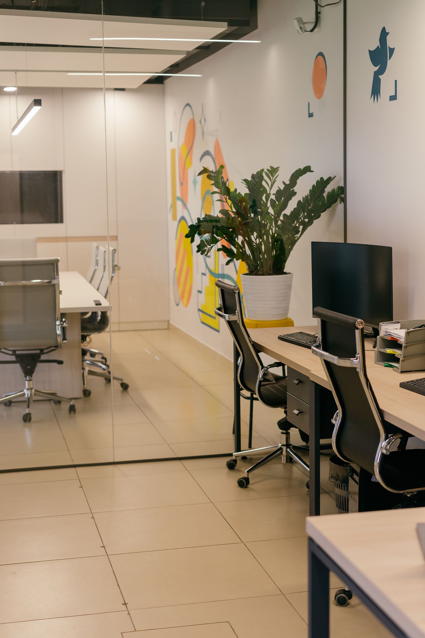 A clean, modern office interior with desks and chairs